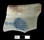 Jar or crock with painted blue design in an indeterminate motif.  Broken lug handle evident - from 18BC88.